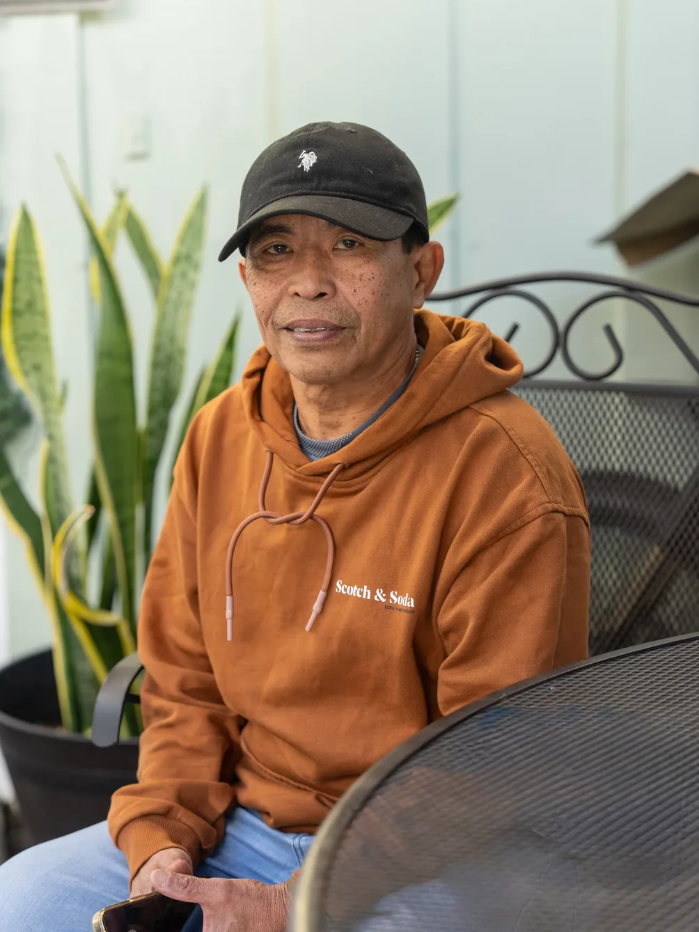 Resident relaxing outdoors in comfortable casual clothing.