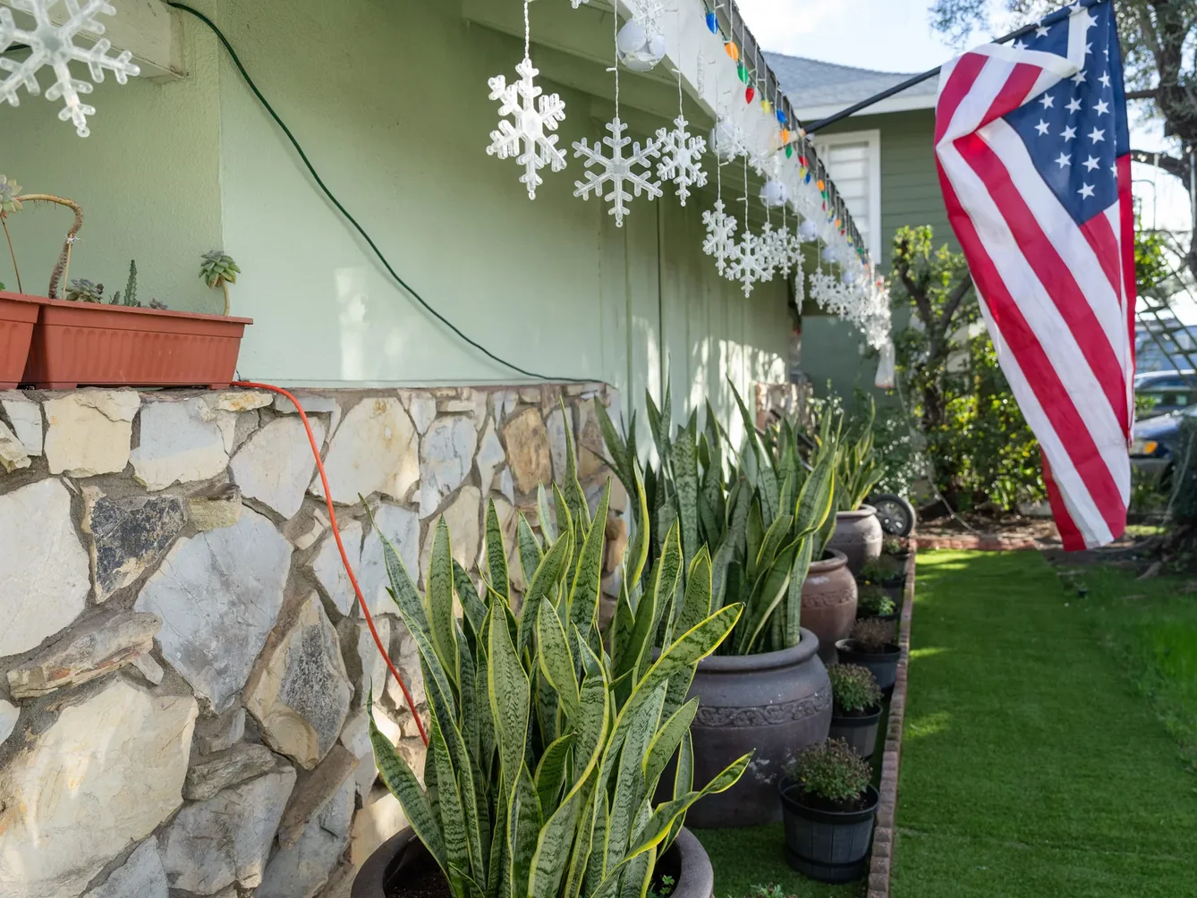Welcoming front porch exterior with patriotic flag display.